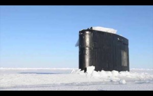 Submarine breaks through ice surfacing in the Arctic